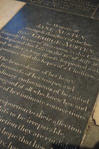 The black inscribed tombstone of Jane Austen.