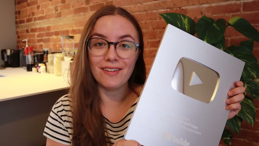 Holding our YouTube creator award