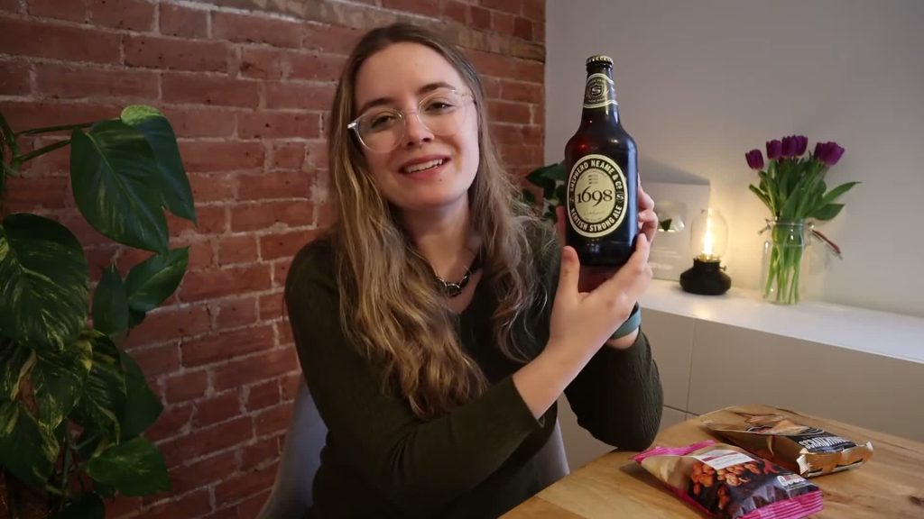 Alanna showing the label on a bottle of Shepherd Neame 1698 Kentish Strong Ale