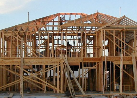 Exposed timber wall and roof framing of a two-storey house under construction in Katy, Texas.